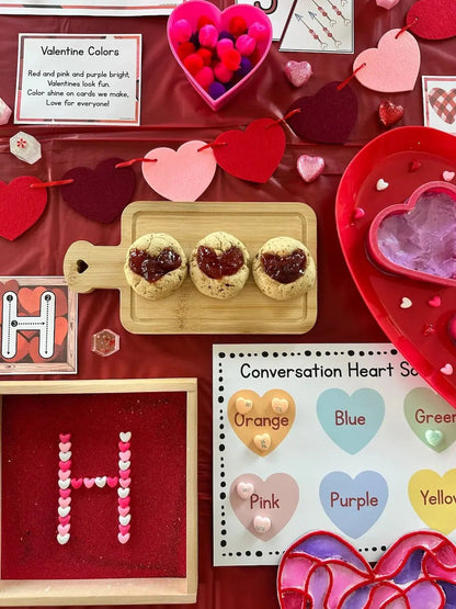 Valentine's Day-themed unit display with cookies, heart-shaped letters, and color chart.